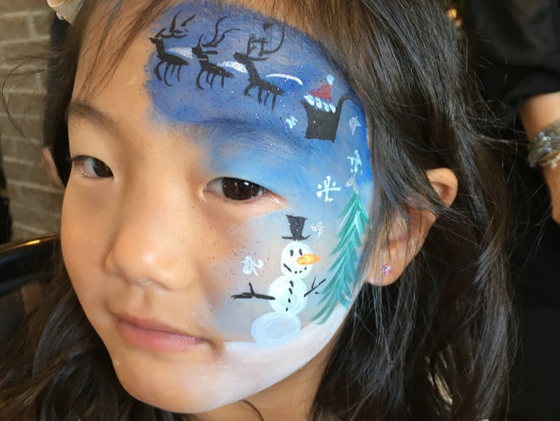 Christmas face paint on little girl